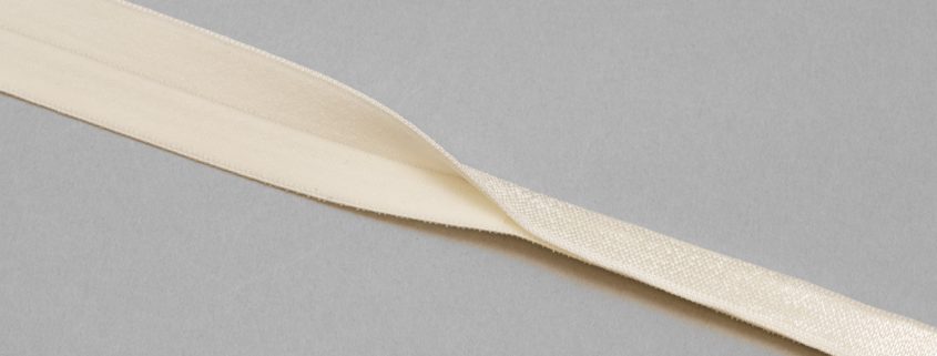 reversible fold-over elastic binding EF-5 ivory or Pantone 11-0507 winter white from Bra-Makers Supply shiny fold shown