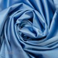 stretch satin mirror satin spandex FR-51 bluebird blue from Bra-Makers Supply twirl shown