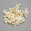 decorative bra bows AB-100 ivory from Bra-Makers Supply bulk bag of 100 shown