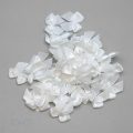 decorative bra bows AB-100 white from Bra-Makers Supply bulk bag of 100 shown