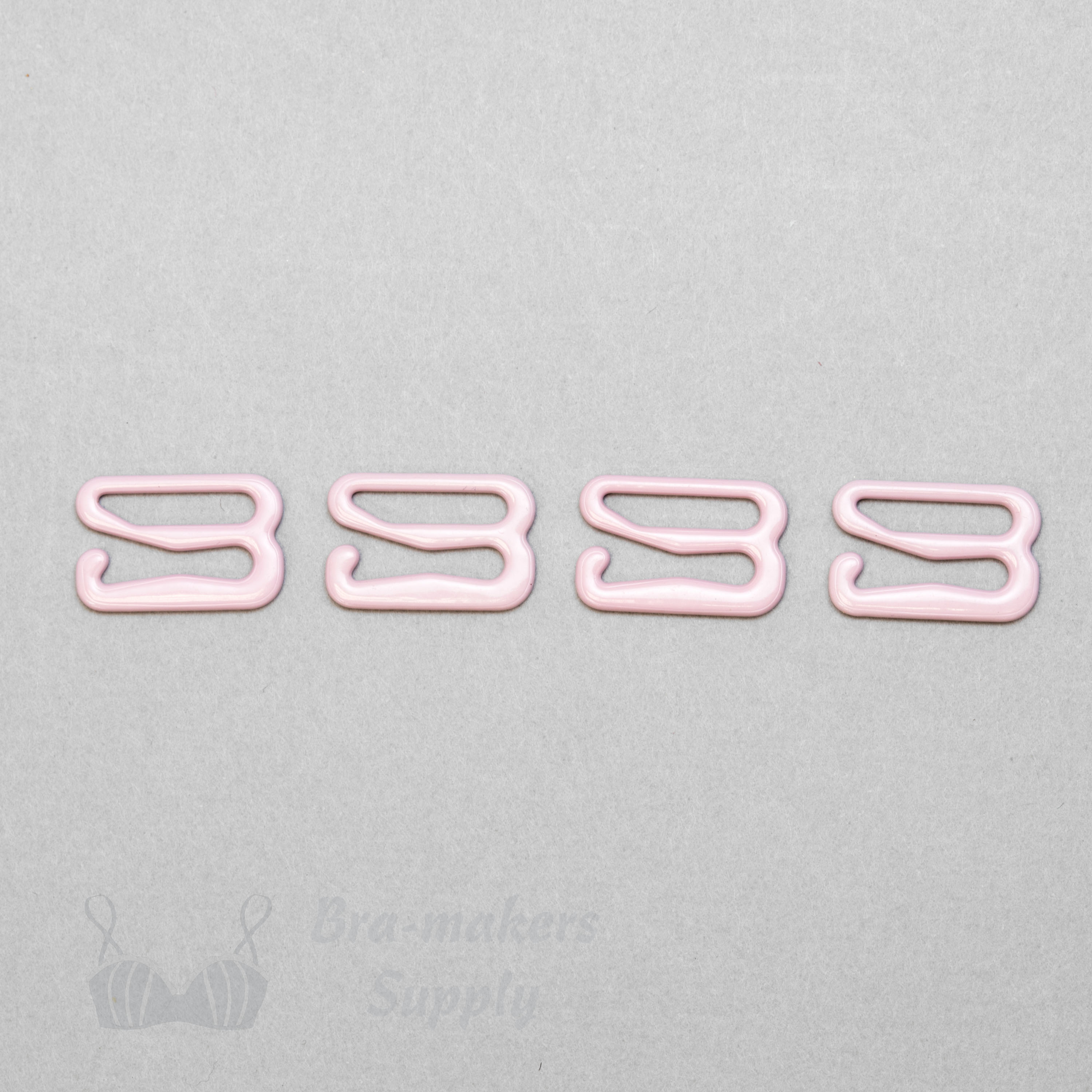 https://www.braandcorsetsupplies.com/wp-content/uploads/2016/10/half-inch-or-12-mm-nylon-coated-metal-g-hooks-GH-41-pink-from-Bra-Makers-Supply-4-hooks-shown.jpg