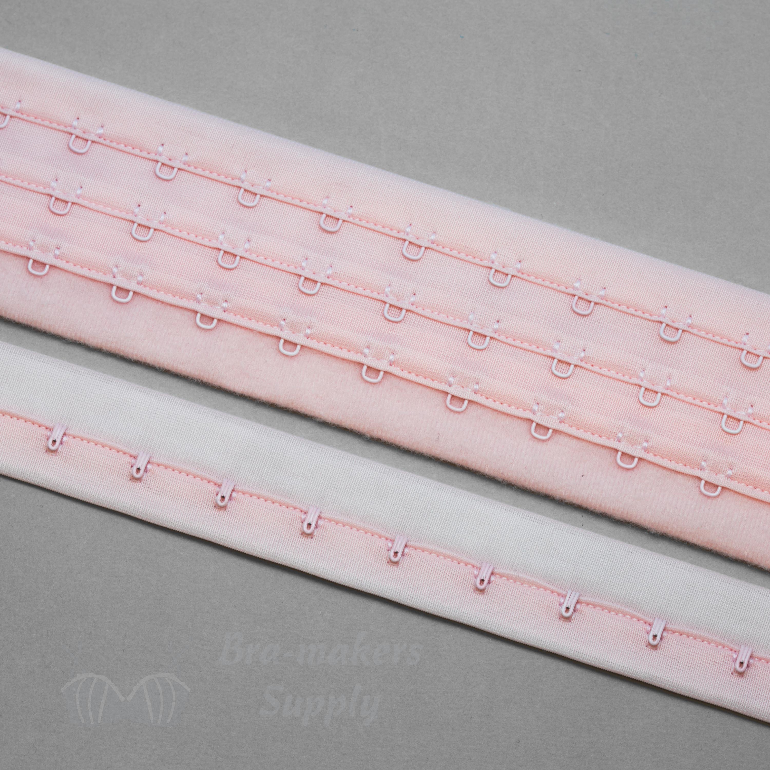 https://www.braandcorsetsupplies.com/wp-content/uploads/2016/10/nylon-hook-and-eye-tape-HE-53-pink-from-Bra-Makers-Supply-separate-shown.jpg