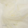 swiss dot tulle fabric FM-3583 off-white from Bra-Makers Supply twirl shown