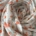 Cotton gauze fabric with small orange flowers