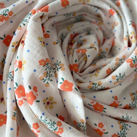 Cotton gauze fabric with small orange flowers